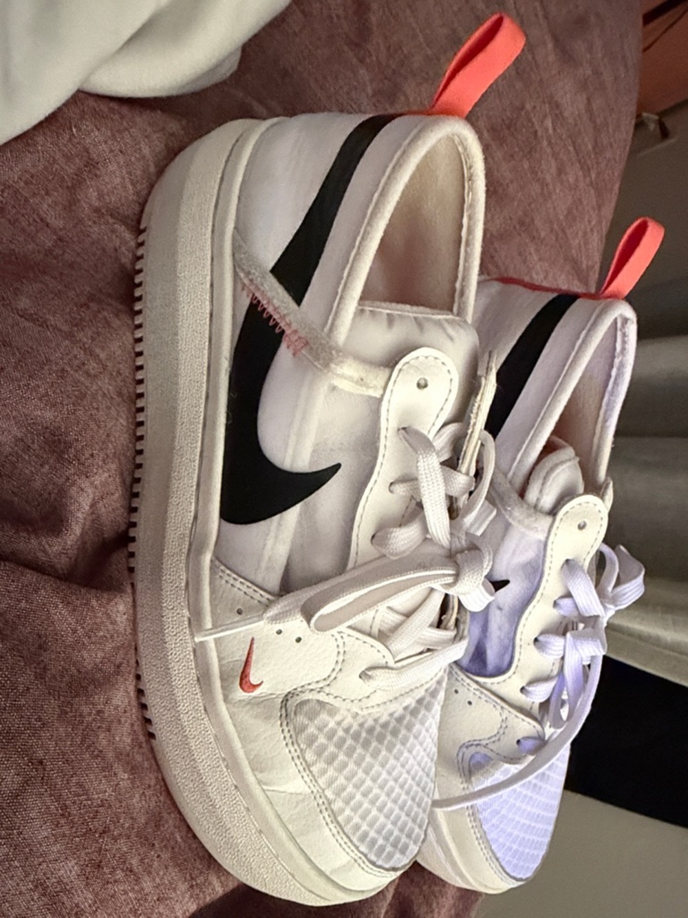 Nike Kids White Sneakers with Black Swoosh and Coral Pull Tabs
